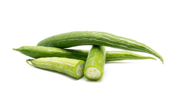 istock whole and slices fresh Snake gourd isolated on white background. 1405570827