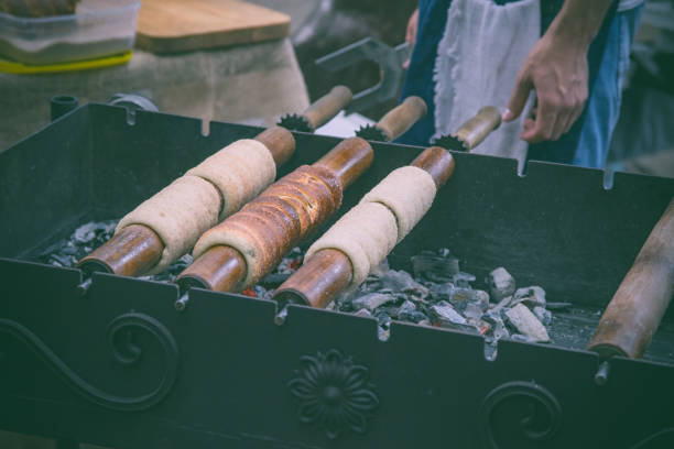 istock Closeup trdelnic baking process. Traditional food 1405571205
