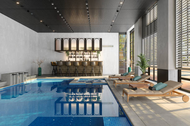 istock Luxury Indoor Swimming Pool With Deck Chairs, Bar Counter And Stools 1405572170