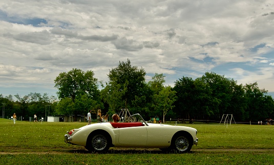 English old timer car MG running on the hypodrome of the Tour de Salvagny on a summer day