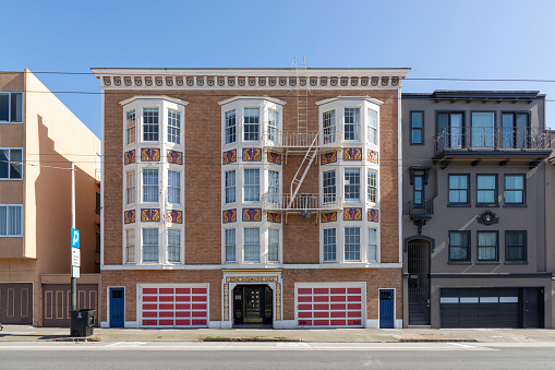 San Francisco, USA - May 18, 2022: typical multi family town house in the Marina area of San Francisco with fireladder at facade.