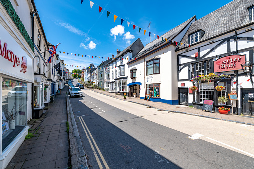 Modbury, UK. Monday 27 June 2022. Variety of shops and cafes in the village of Modbury in Devon, UK.