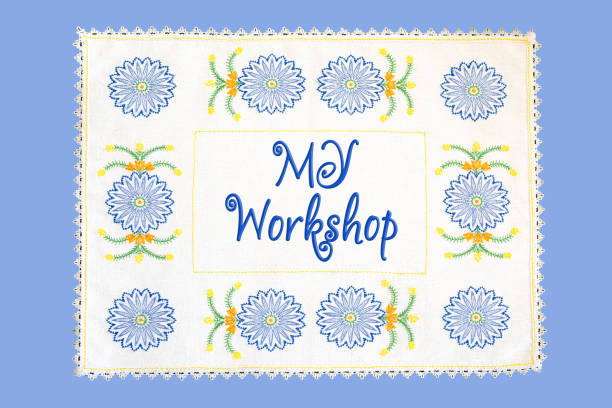 istock Frame in the form of a floral patch with text - my workshop, on a blue background. 1405576266