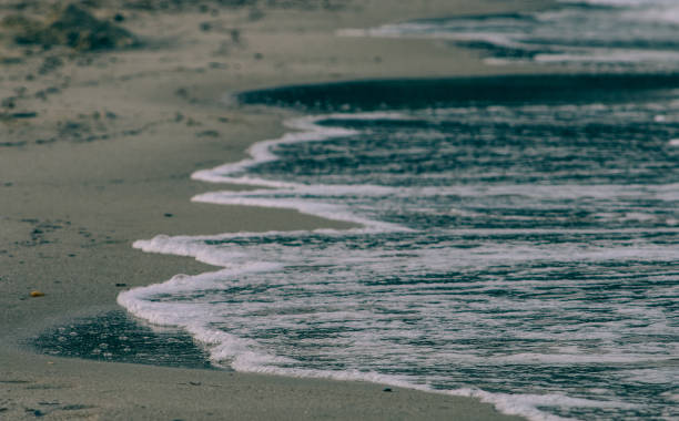 istock Sea waves foam and sand 1405579475
