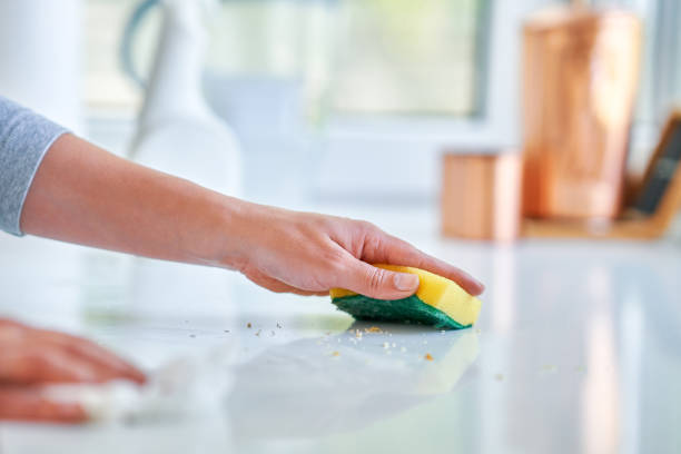 istock Young woman cleaning dirt in the kitchen 1405580837