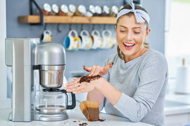 istock Young woman with coffee grounds use it for peeling 1405580882