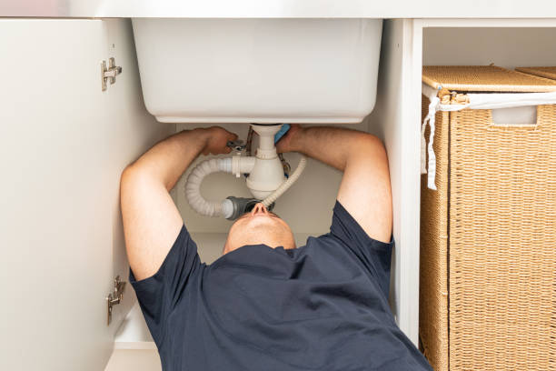 istock man fixing the sink siphon in the laundry room with his own hands 1405582993