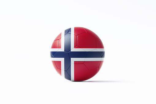 Soccer ball textured with Norwegian flag sitting on white background. Horizontal composition with copy space. Clipping path is included.