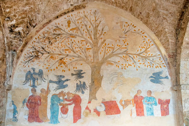Medieval Fresco in Massa Marittima - Tuscany 'Albero della Fertilità' - Tree of Fertility, fresco visible in the portico of the Palazzo dell'Abbondanza, a medieval building in Massa Marittima medieval fresco stock pictures, royalty-free photos & images