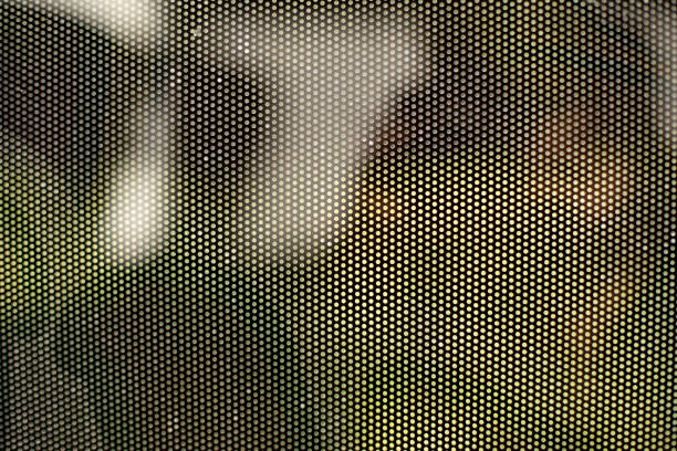 istock Mesh texture on glass. Shooting window. Small cage. 1405590484