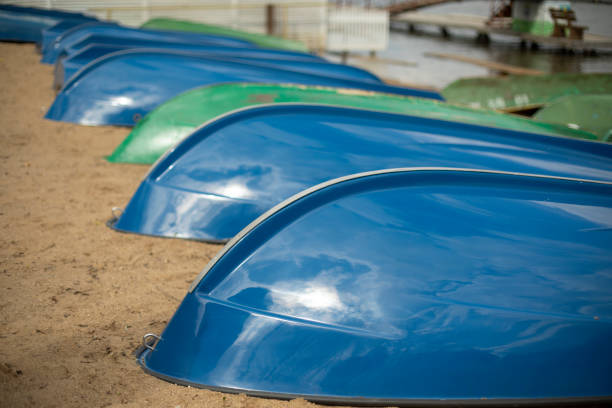 Blue boats on sand. Boat station. Boats dry up on shore.