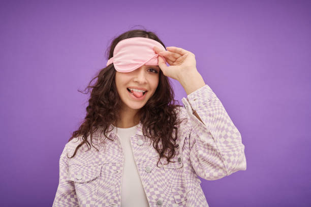 istock Girl in sleep mask having fun 1405592268