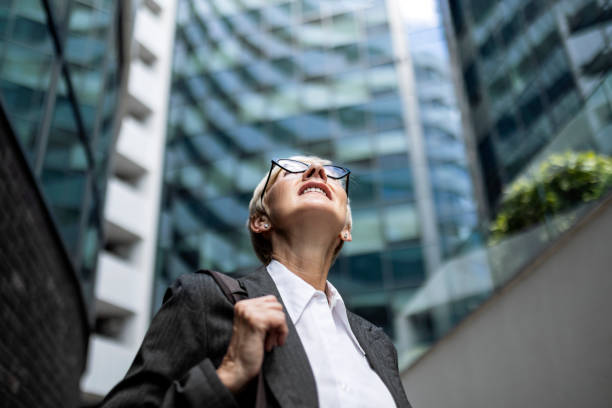 istock Mature businesswoman looking up 1405592584