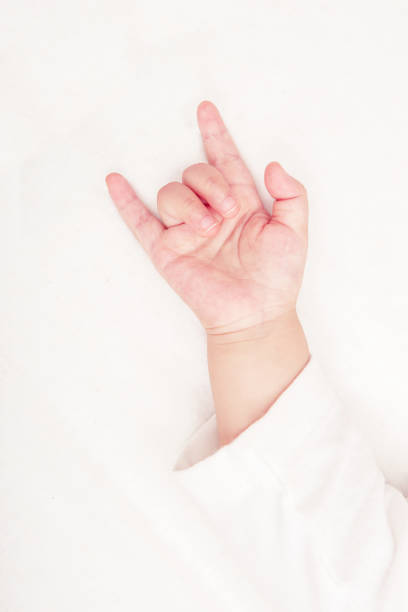 Baby hand with love symbol (Soft focus and blurry)