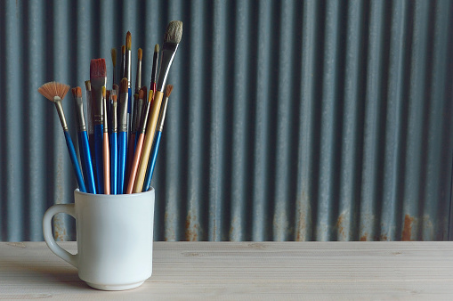 Paintbrushes  in the mug cup