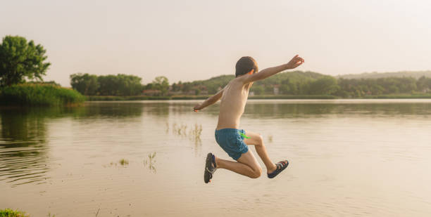 istock Jumping into the lake 1405595819