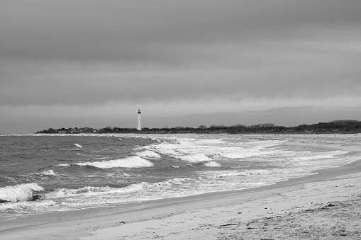 Beach with lighthouse in background, Cape May, New Jersey, USA