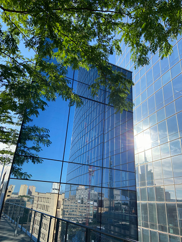 Reflection of cityscape in glassy building, Philadelphia, USA