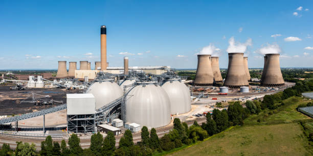 Aerial landscape view of Drax Power Station with Biomass storage tanks Aerial landscape view of a large coal fired power plant with storage tanks for Biofuel burning instead of coal cooling tower photos stock pictures, royalty-free photos & images