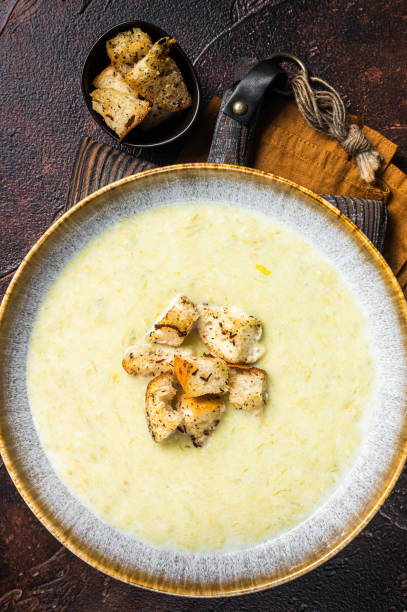istock Leek soup Vichyssoise with croutons. Dark background. Top view 1405596942