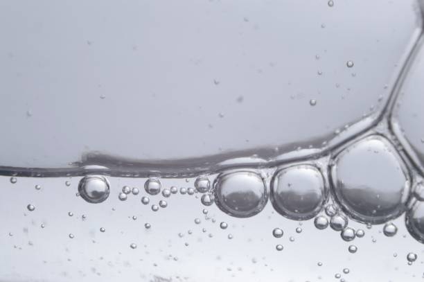 istock air bubbles in a transparent liquid close-up. micro. 1405597971