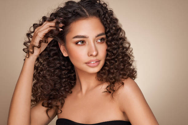 istock Beautiful smiling woman with afro curls 1405599258