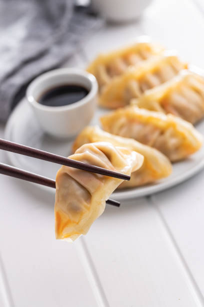 istock Chinese dumplings on plate. 1405599641