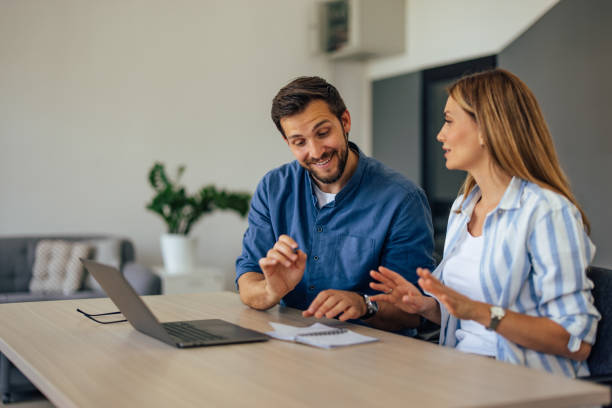 istock Smiling male boss having a meeting with his female client. 1405602311