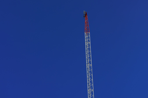 Large crane and blue sky.