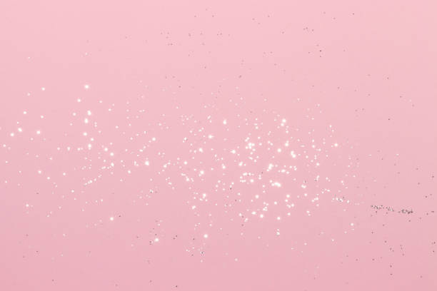 istock Sparkling silver glitter on pink background 1405606194