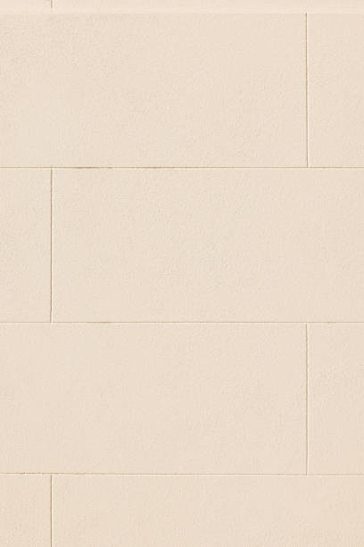 istock Part of a cream colored concrete block wall 1405607208