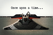 istock Once Upon A Time, says beginning of story on a page in an old-fashioned retro typewriter 1405608122