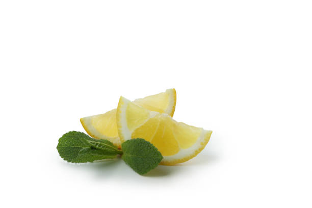 istock Slices of lemon isolated on white background 1405608842