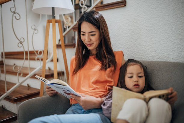 istock Daughter and japanese mom read a book 1405609016