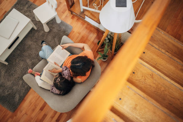 istock Daughter and japanese mom read a book 1405609090