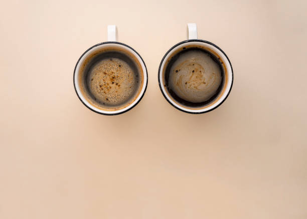 istock Two cups of coffee, top view on neutral background. Coffee cups mockup with space for text 1405609227