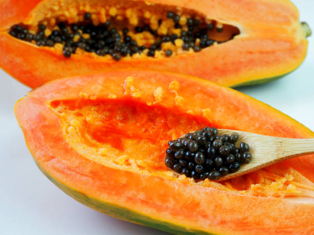 istock Papaya seeds in a wooden spoon. 1405609387