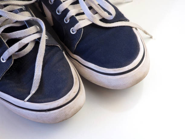 istock Blue canvas sneakers with white rubber soles. 1405609579