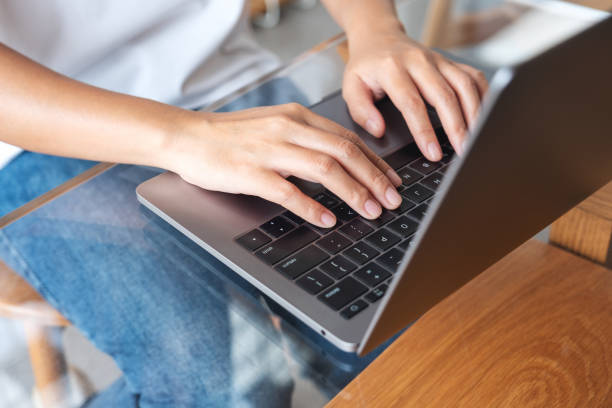 istock Closeup image of hands typing on laptop computer keyboard 1405610209