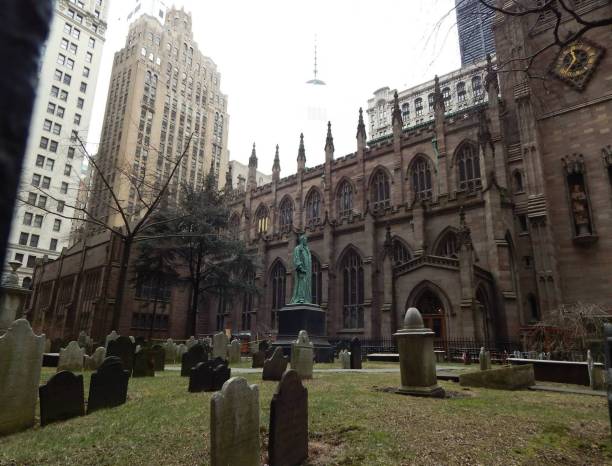Trinity Church is a church located at the intersection of Wall Street and Broadway south of Manhattan, in New York City. stock photo