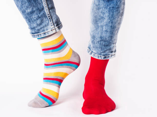 istock Men's legs and bright socks. Without shoes 1405611105