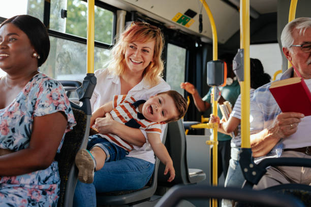 Mom and her son playing during bus ride