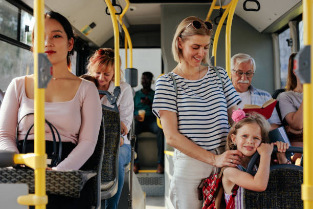 istock Mom and daughter on bus going to school 1405612180