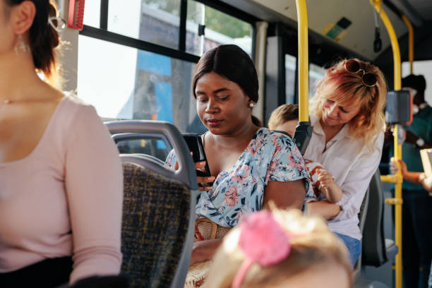 istock African american woman texting in bus 1405612184