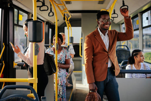 istock Young black businessman on public bus 1405612208