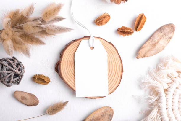 Rectangle white tag mockup on a white background with cotton string and boho decoration, dry plants, element for packing