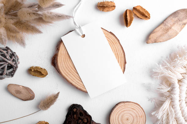 istock Rectangle white tag mockup on a white background with cotton string and boho decoration, dry plants, element for packing 1405612383