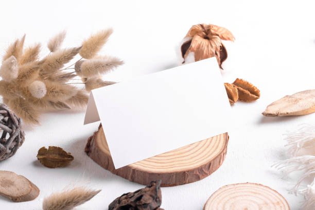 istock Wedding stationery folded blank card mockup 3,5x2 size on white table background with boho decor 1405612431