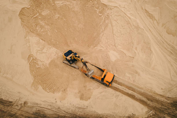 istock Excavator loading sand into truck in opencast sand quarry 1405612472