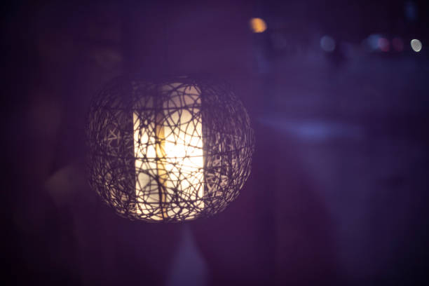 istock Lamp on purple background. Designer light. 1405614348